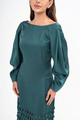 Close-up detail of the dress, highlighting the intricate laser-cut pattern and the texture of the luxurious satin-crepe fabric.