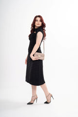 The designer top styled, showcasing the silhouette with cap sleeves
