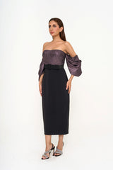 The dress styled with the detachable belt cinched at the waist, emphasizing the structured silhouette and midi length.