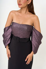 Close-up detail of the bodice, showcasing the contrast between the lustrous lamé fabric and the matte crepe paneling.