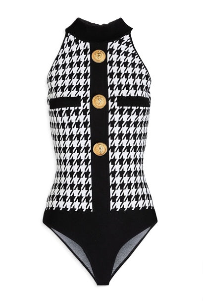 Detail of the zip fastening along the back and the snap closure at the base of the Balmain bodysuit.