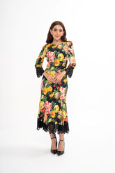 Dolce & Gabbana floral print midi dress for rental, featuring a vibrant print and elegant lace trim.