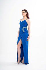 Full-length view of the Balmain gown on a model, showcasing the elegant drape of the wrap silhouette and spaghetti straps