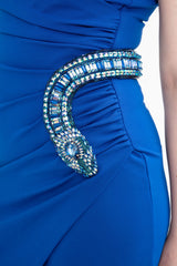 Close-up detail of the dazzling crystal snake embellishment at the waist, highlighting the intricate craftsmanship and snake head detail
