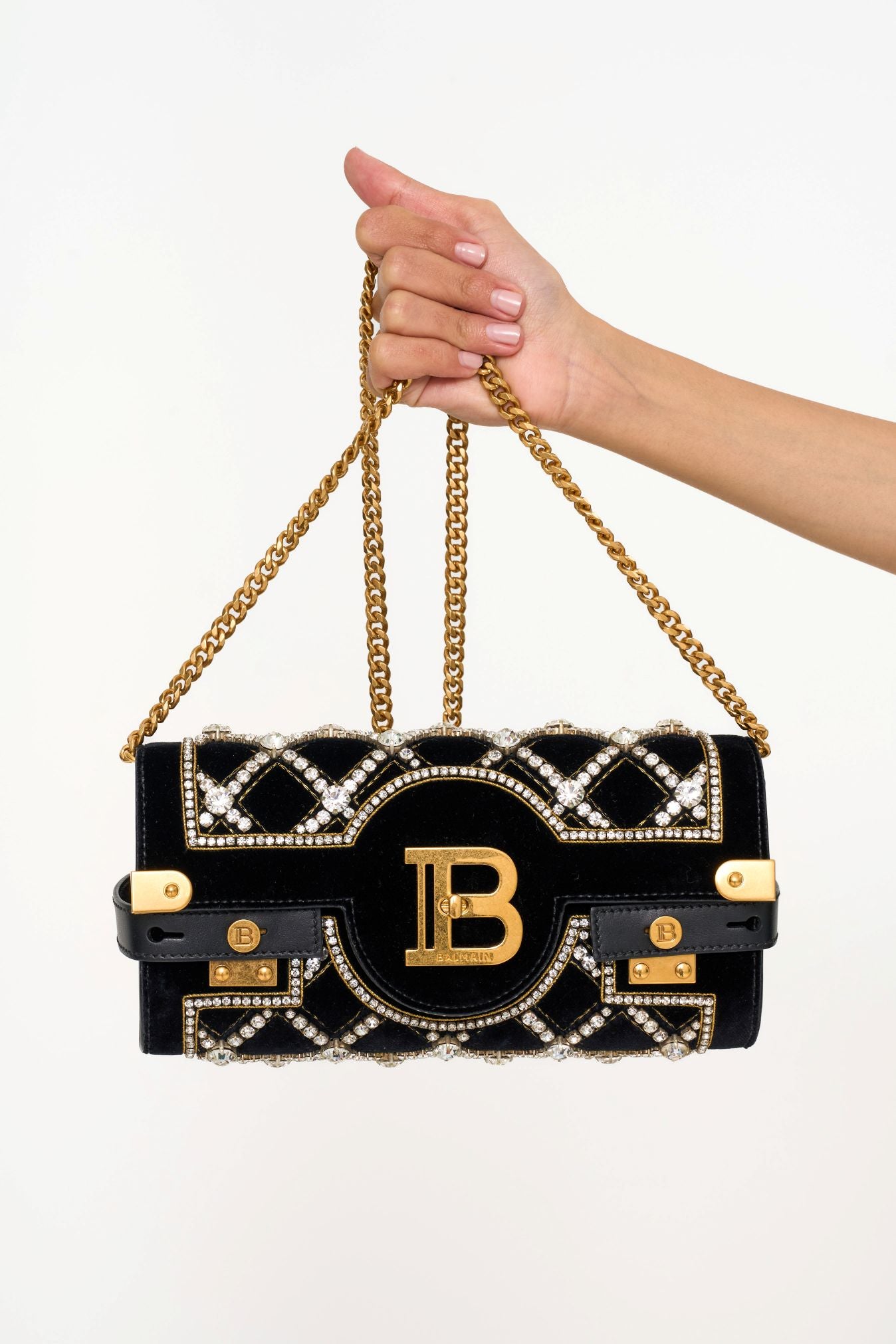 Close-up of Balmain BBuzz Crystal Evening Bag clutch black velvet with rhinestones rental Kuala Lumpur”