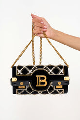 Close-up of Balmain BBuzz Crystal Evening Bag clutch black velvet with rhinestones rental Kuala Lumpur”