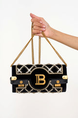 Close-up of Balmain BBuzz Crystal Evening Bag clutch black velvet with rhinestones rental Kuala Lumpur”
