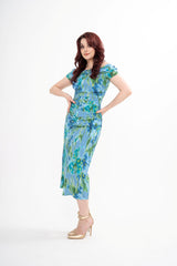 Carolina Herrera floral print midi dress for rental, featuring an off-the-shoulder neckline and ruched detailing, photographed in Sri Hartamas, Malaysia.