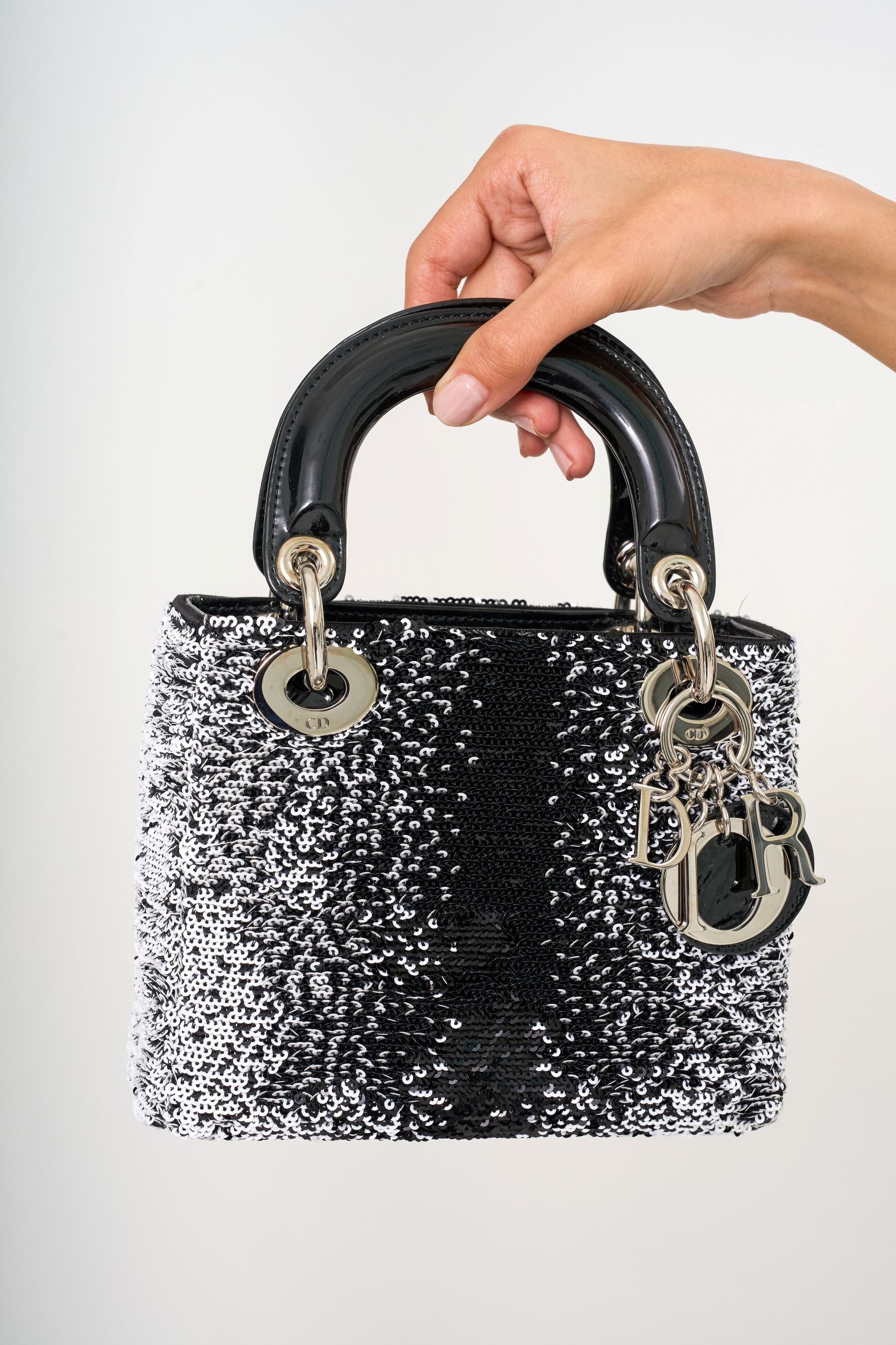 Close-up of the Dior sequined cannage stitching and the iconic D.I.O.R. charm details.