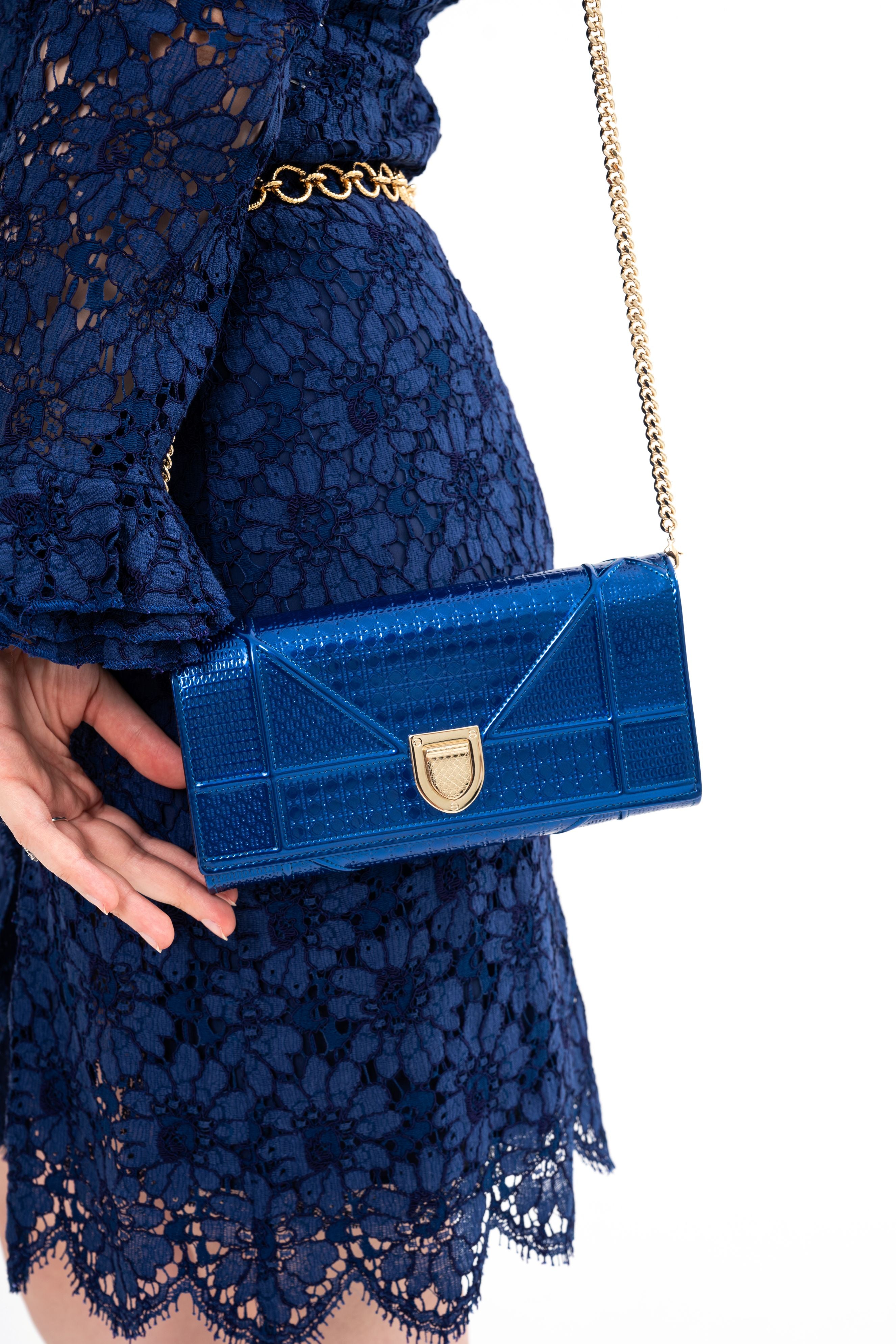 Close-up detail of the Diorama bag's patent leather surface, highlighting the unique luster and quilted texture.