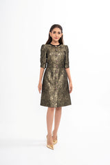 Dolce & Gabbana gold mini dress for rental, crafted from metallic brocade with button embellishments and a front slit, photographed in Sri Hartamas, Malaysia.