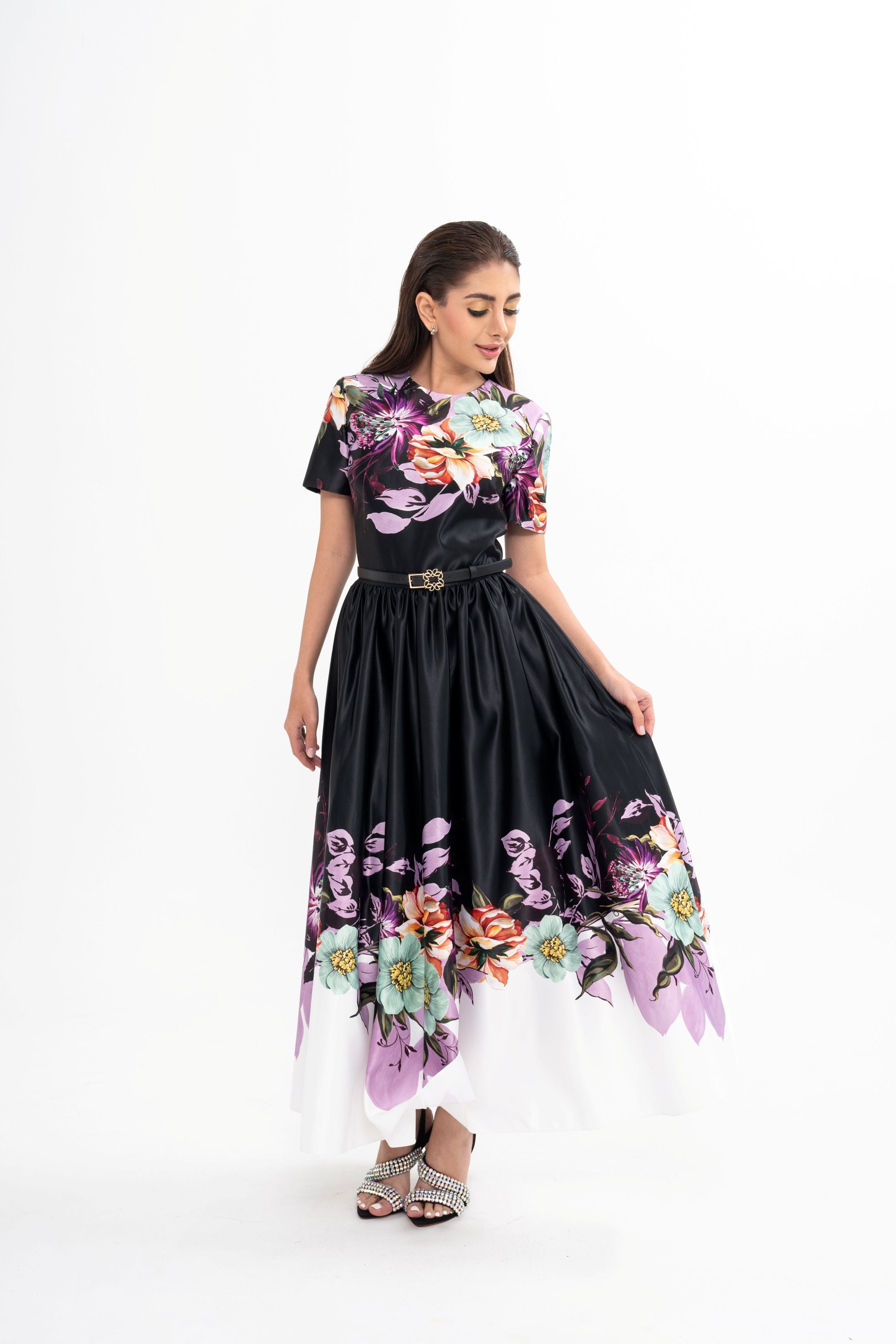 The dress styled on a model, showcasing the flattering A-line silhouette and the elegant midi length.