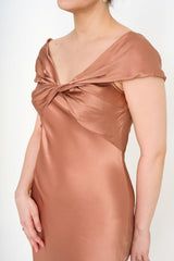 Close-up of the gown's bodice, highlighting the artistic twisted satin-crepe fabric and the rich Antique Rose colour.