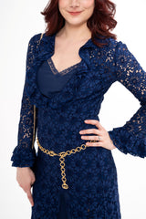 Close-up detail of the belt, highlighting the gold GG hardware and the intricate texture of the corded lace.