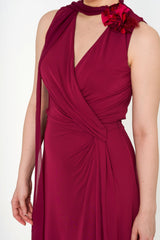 Close-up of Gucci maxi dress showing scarf embellishment and fabric details