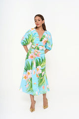 The dress styled on a model, showcasing the cinched waist with the detachable belt and the elegant midi length.