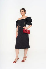 Carolina Herrera bustier top in black stretch-wool twill with button embellishments for rental, photographed in Sri Hartamas, Malaysia.