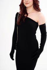 Close-up detail of the ribbed, stretchy fabric and the buttoned cuffs of the designer dress.