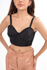 Close-up of the bustier, showing the topstitching detail and the internal corset structure with underwire support.
