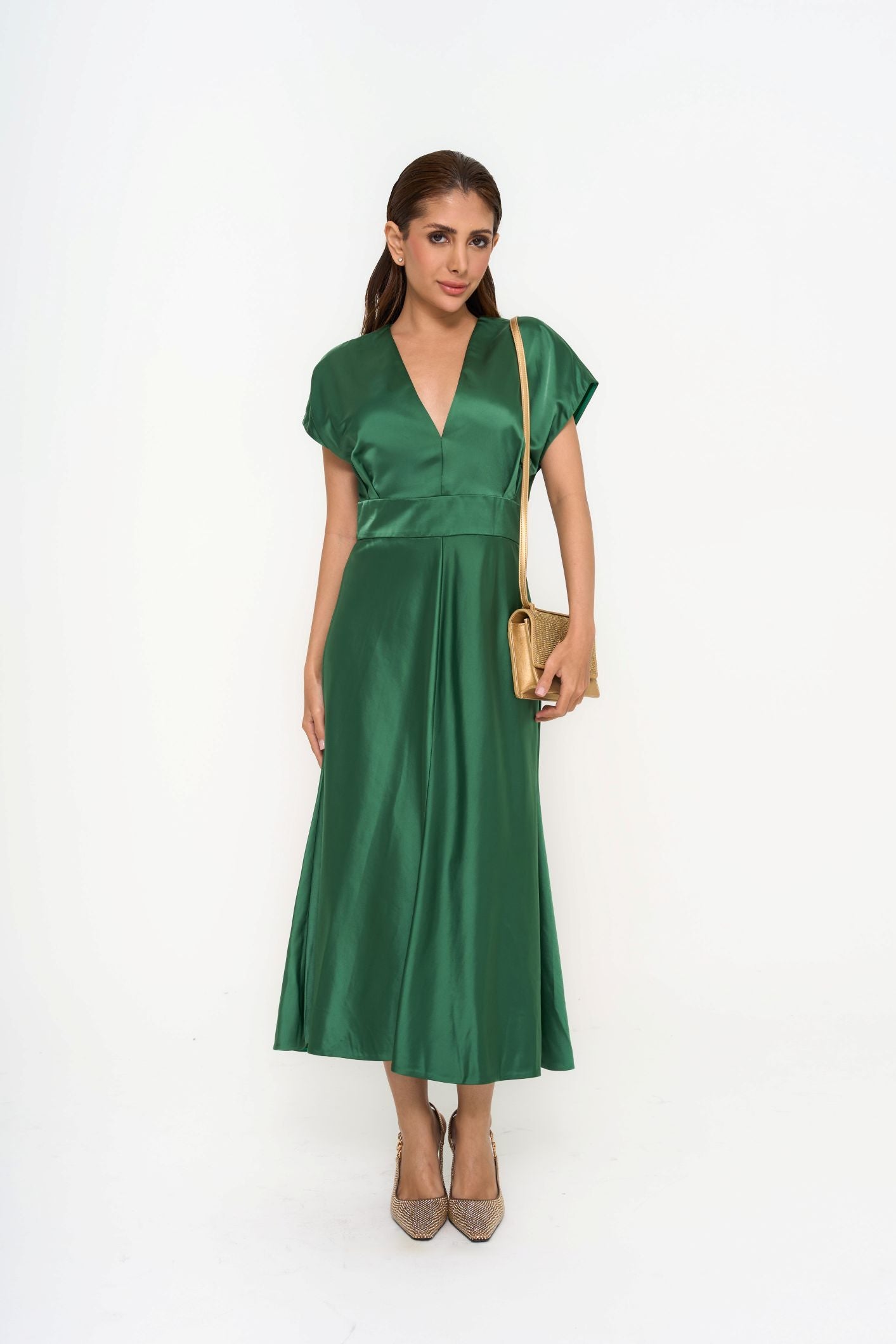 Lela Rose A-line dress in lustrous emerald satin-crepe with pleated detailing for rental, photographed in Sri Hartamas, Malaysia.