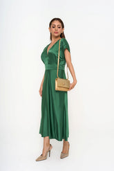 Versace crossbody bag crafted from metallic calf leather with crystal embellishments and designer plaque, photographed in Kuala Lumpur, Malaysia.