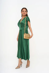 Full-length view of the dress on a model, showcasing the fluid drape, A-line silhouette, and mid-calf length.