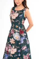 Close-up detail of the brocade fabric, highlighting its luxurious texture and the rich forest green color.