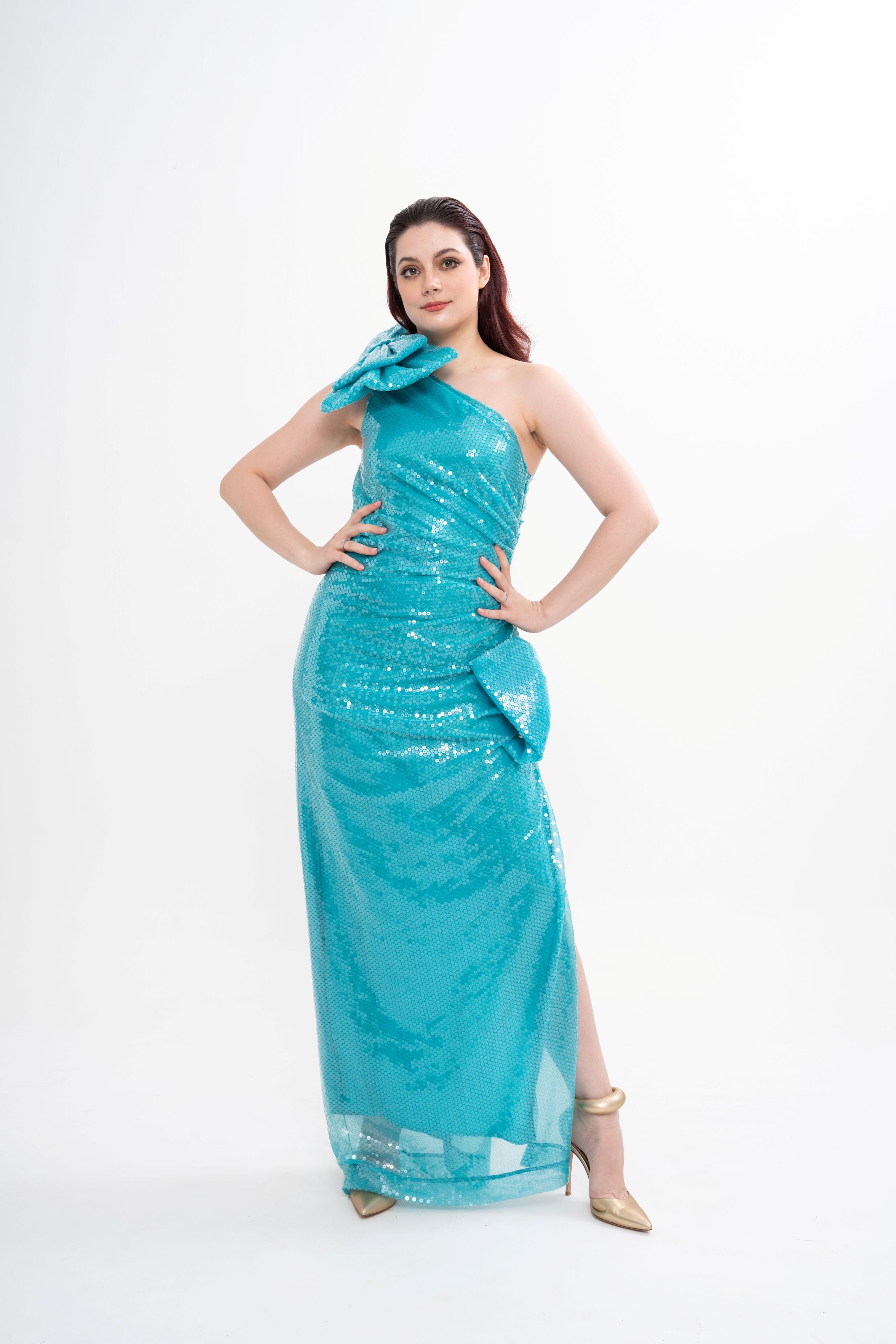Nina Ricci one-shoulder maxi dress for rental, in turquoise sequined tulle with large asymmetrical bow details and a side split, available with doorstep delivery across Malaysia.