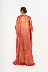 Full-length back view of the Oscar de la Renta gown on a model, emphasizing the fluid drape and elegant, relaxed fit. Rent today at Clarissima