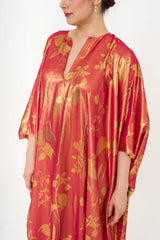 Close-up detail of the gown's fabric, showcasing the subtle shimmering metallic floral-jacquard weave and the hook-fastening keyhole neckline. Available for rent at Clarissima boutique in Sri Hartamas