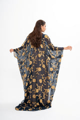 Back view of Oscar de la Renta black silk gown for rental, featuring gold floral metallic fil coupé embroidery rent at Clarissima boutique Sri Hartamas