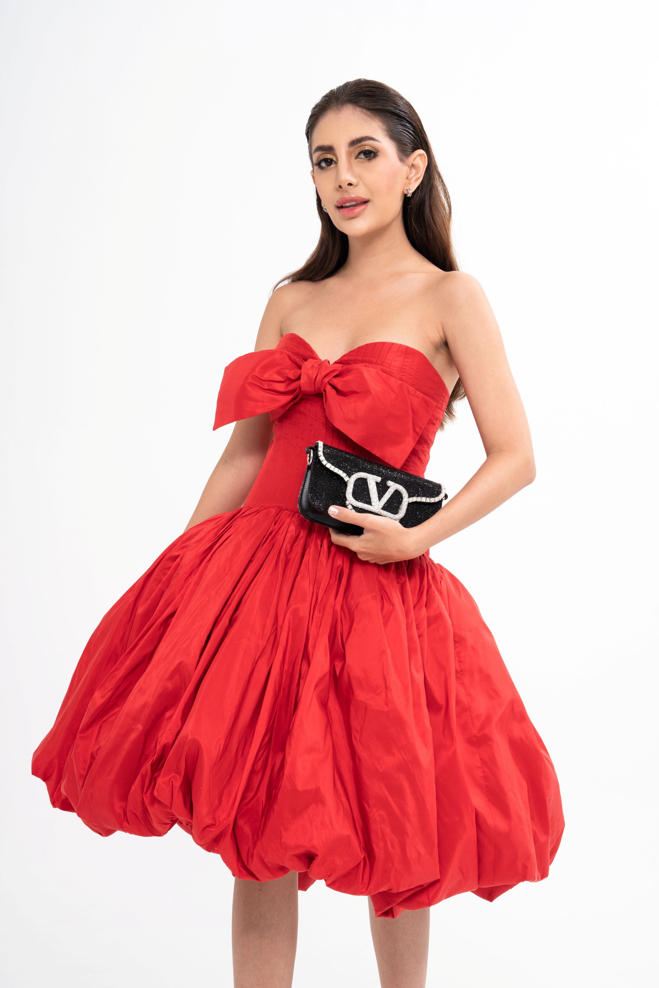 Oscar de la Renta mini dress for rental, crafted from teal silk-taffeta with quilting and bow embellishments, photographed in Sri Hartamas, Malaysia.