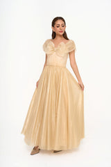 Jenny Packham off-the-shoulder gown in voluminous golden glittered tulle with a bow detail for rental, photographed in Sri Hartamas, Malaysia.