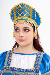 Close-up of the majestic Russian Kokoshnik tiara, highlighting the tall shape and the intricate golden and white pearl beadwork.