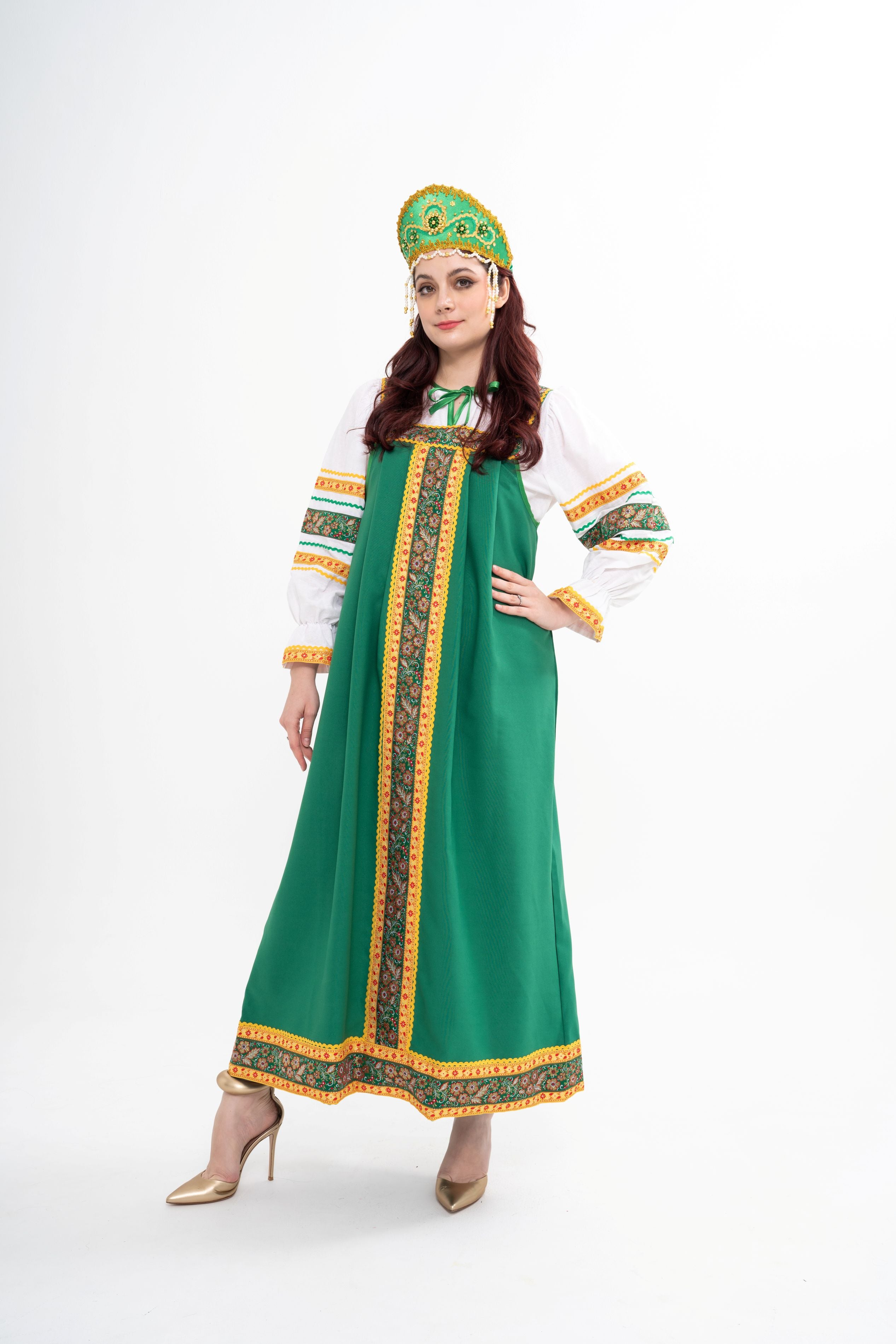 Traditional Russian Folksong costume for rental, featuring a red sarafan, white rubashka blouse, and embroidered Kokoshnik headpiece, photographed in Sri Hartamas, Malaysia.