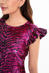 Close-up detail of the dress, highlighting the shimmering sequin embroidery over the pink animalier pattern, available for rental in Kuala Lumpur, Malaysia.