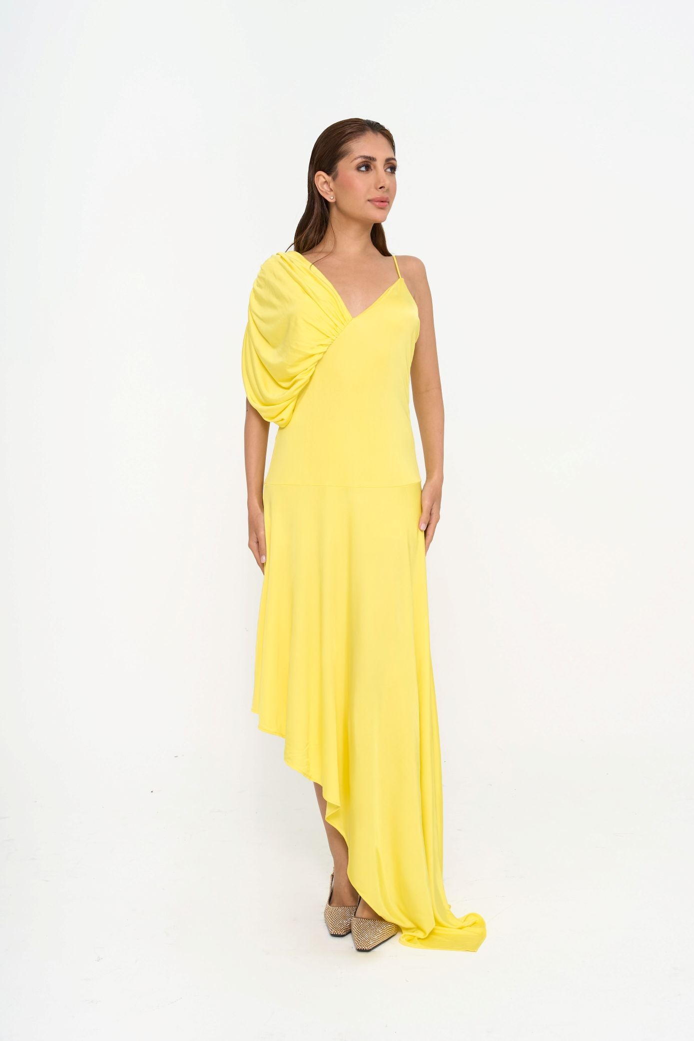 Stella McCartney draped midi jersey dress in vibrant 'Lemon' yellow with asymmetric hem for rental, photographed in Sri Hartamas, Malaysia.