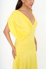 Close-up detail of the gathered draped shoulder and smooth jersey texture of the Stella McCartney dress.