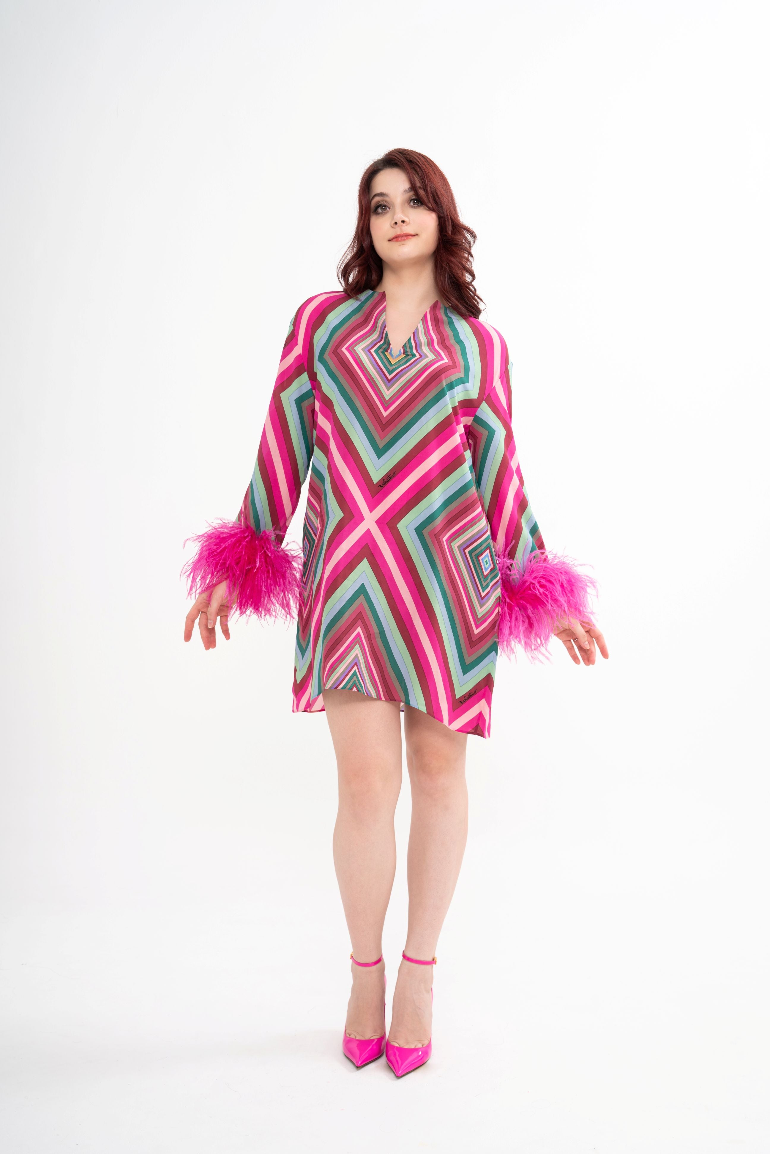 Valentino mini dress for rental, crafted from multicolor pastel silk with full ostrich feather trim at the hem, photographed in Sri Hartamas, Malaysia.