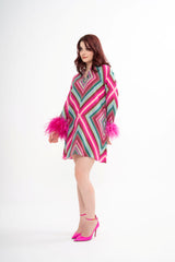 The Valentino feather mini dress styled, emphasizing the playful movement and the short length, available for rental in Kuala Lumpur, Malaysia.