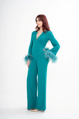 The designer jumpsuit styled, showcasing the full-length silhouette and the elegant, seamless fit.