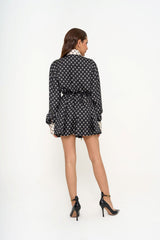 Full-length view of the black and white Valentino playsuit on a model or mannequin, showcasing the fluid movement and elegant finish, available for rental in Kuala Lumpur, Malaysia.