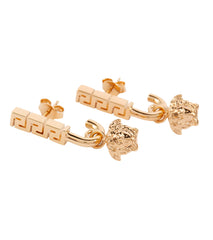 Versace Medusa and Greca earrings for rental, featuring a bold gold-tone metal design, photographed in Sri Hartamas, Malaysia.