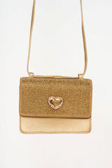 Close-up showing the crystal detailing on the Versace bag, highlighting the light-catching shimmer and structured finish.