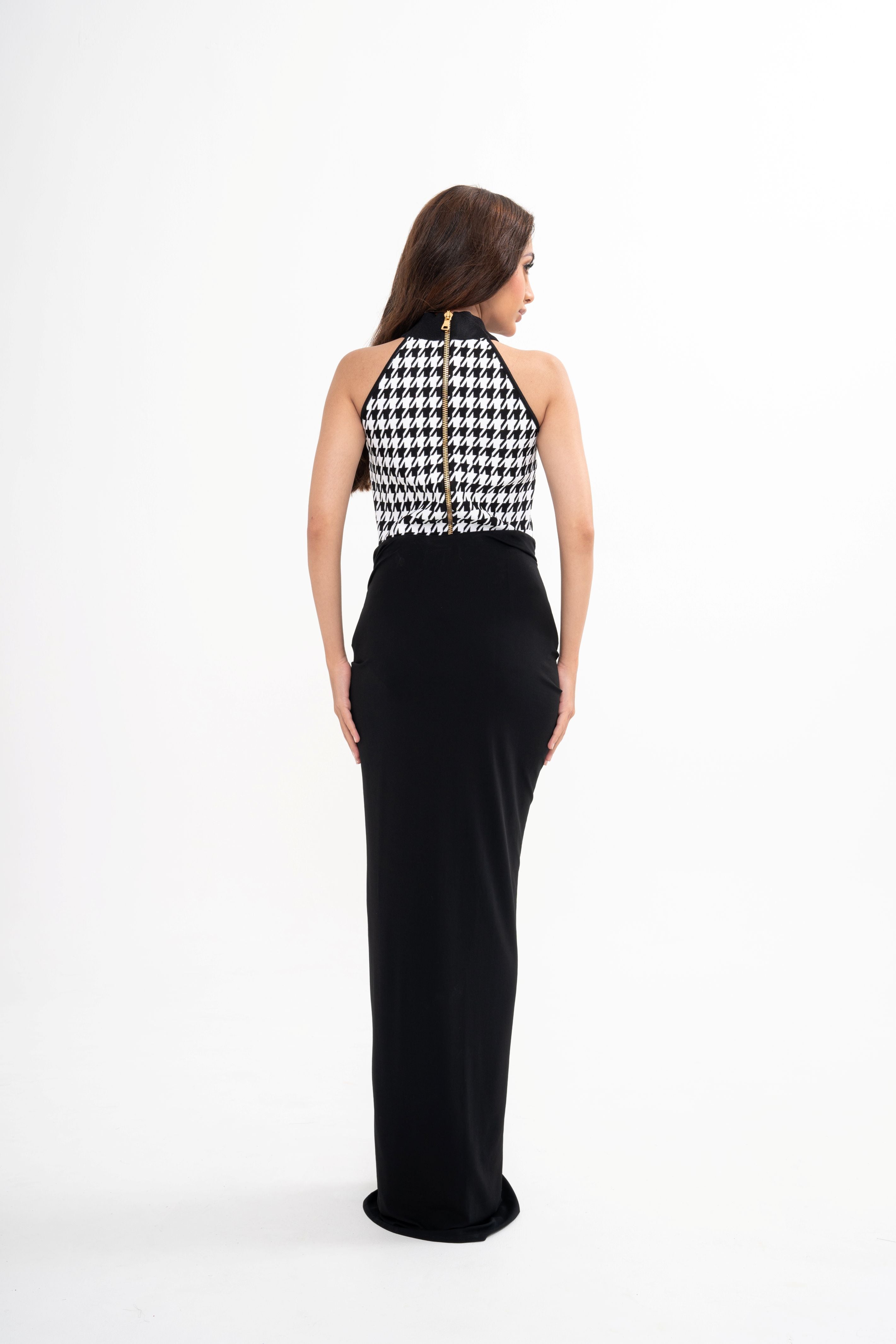 Detail of the zip fastening along the back and the snap closure at the base of the Balmain bodysuit.