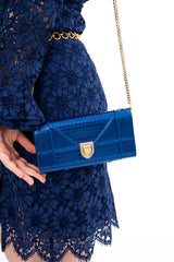 Detail of the scalloped trims and the front slit on the Gucci lace dress, available for rental in Kuala Lumpur, Malaysia