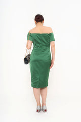 Full-length back view of the dress on a model, showcasing the sculpted silhouette and the subtle back slit for movement.