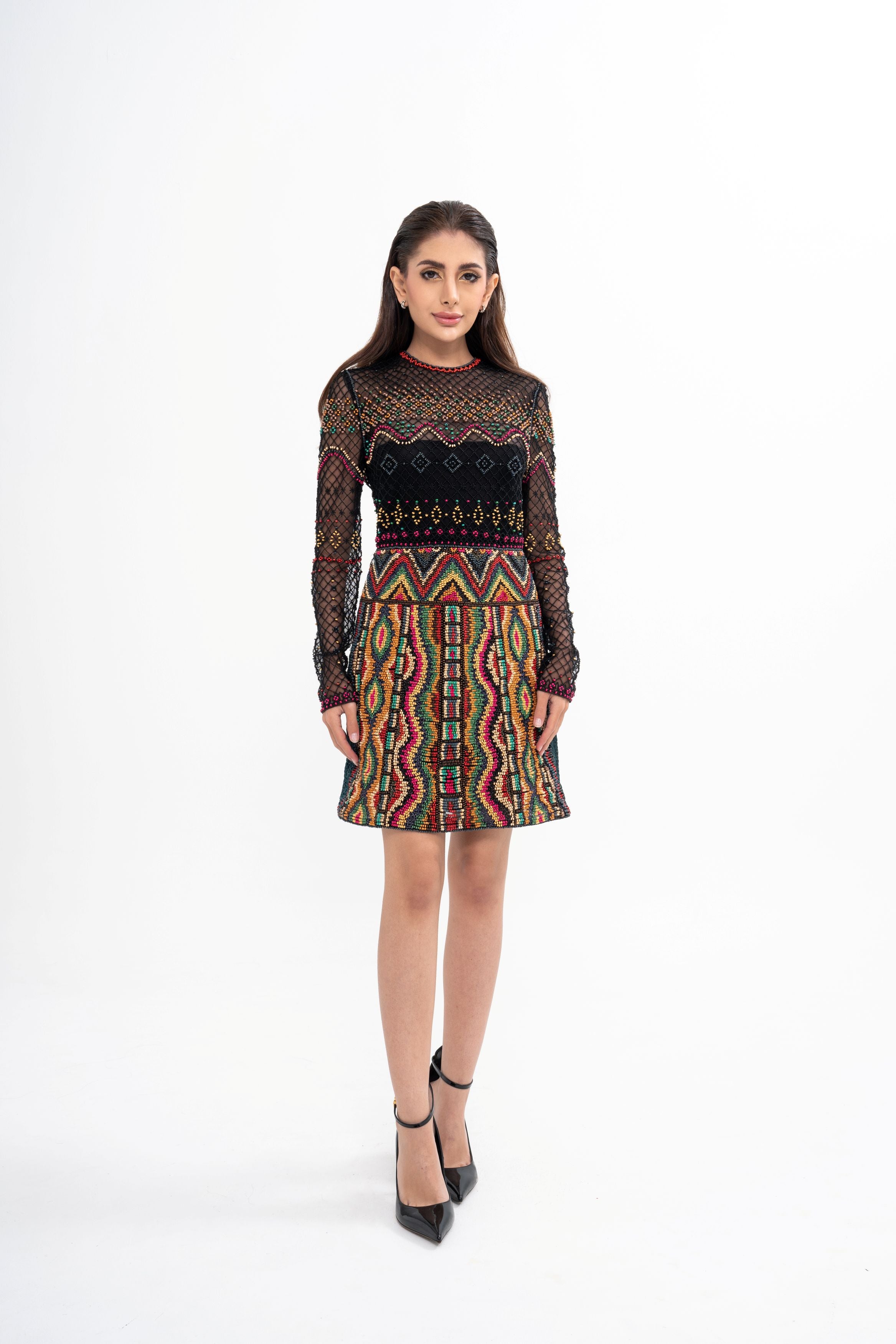 The designer dress styled, showcasing the mini length and the structure of the embroidered bodice.