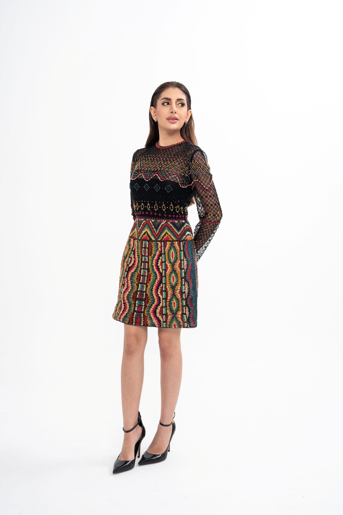 Valentino black semi-sheer mini dress for rental, crafted from tulle and faux raffia with intricate embroidery and bead embellishment, photographed in Sri Hartamas, Malaysia