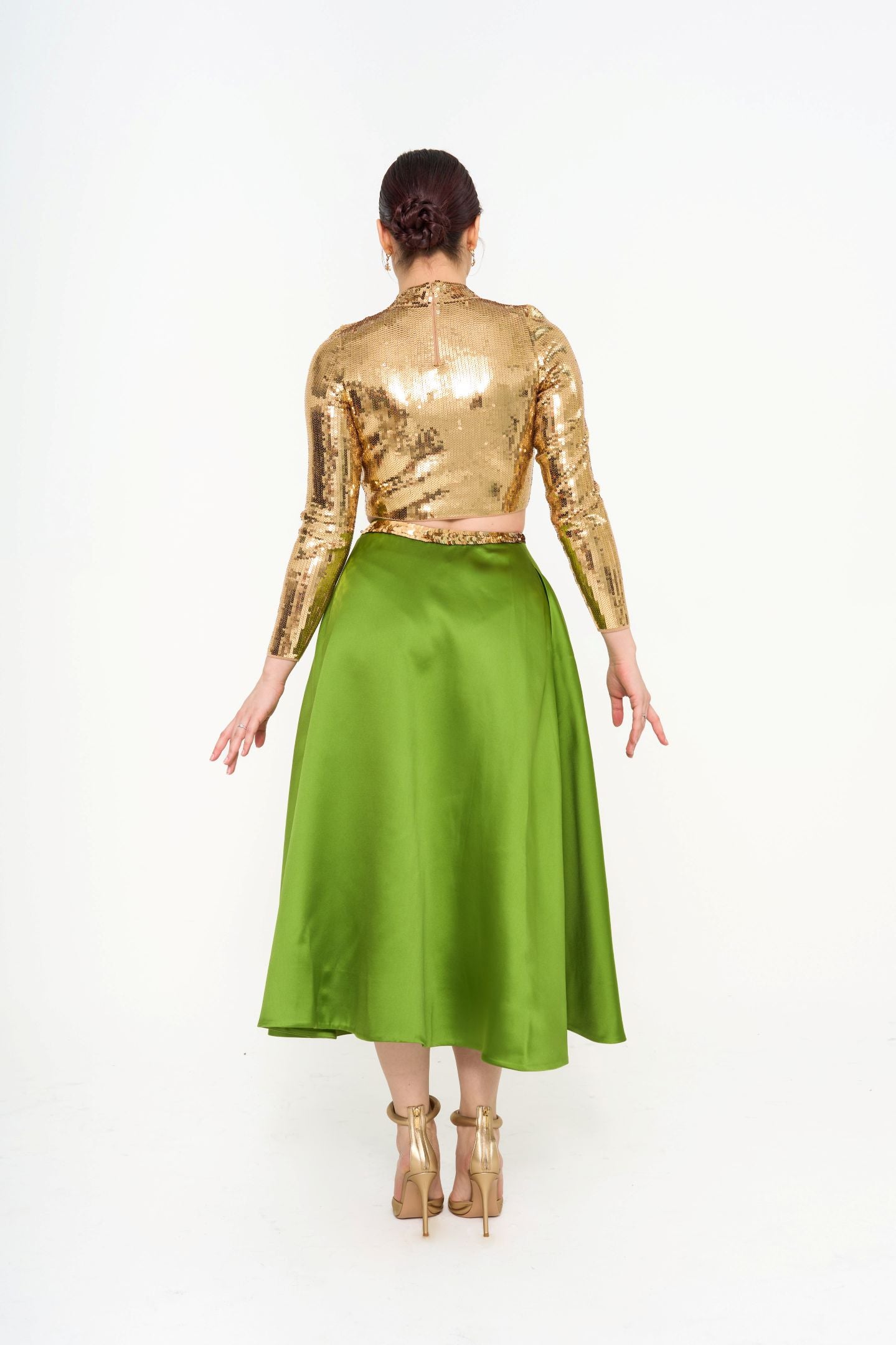 Rear view of the Valentino emerald ribbon skirt, illustrating the side zip fastening and the fully lined interior, available for rental in Kuala Lumpur, Malaysia